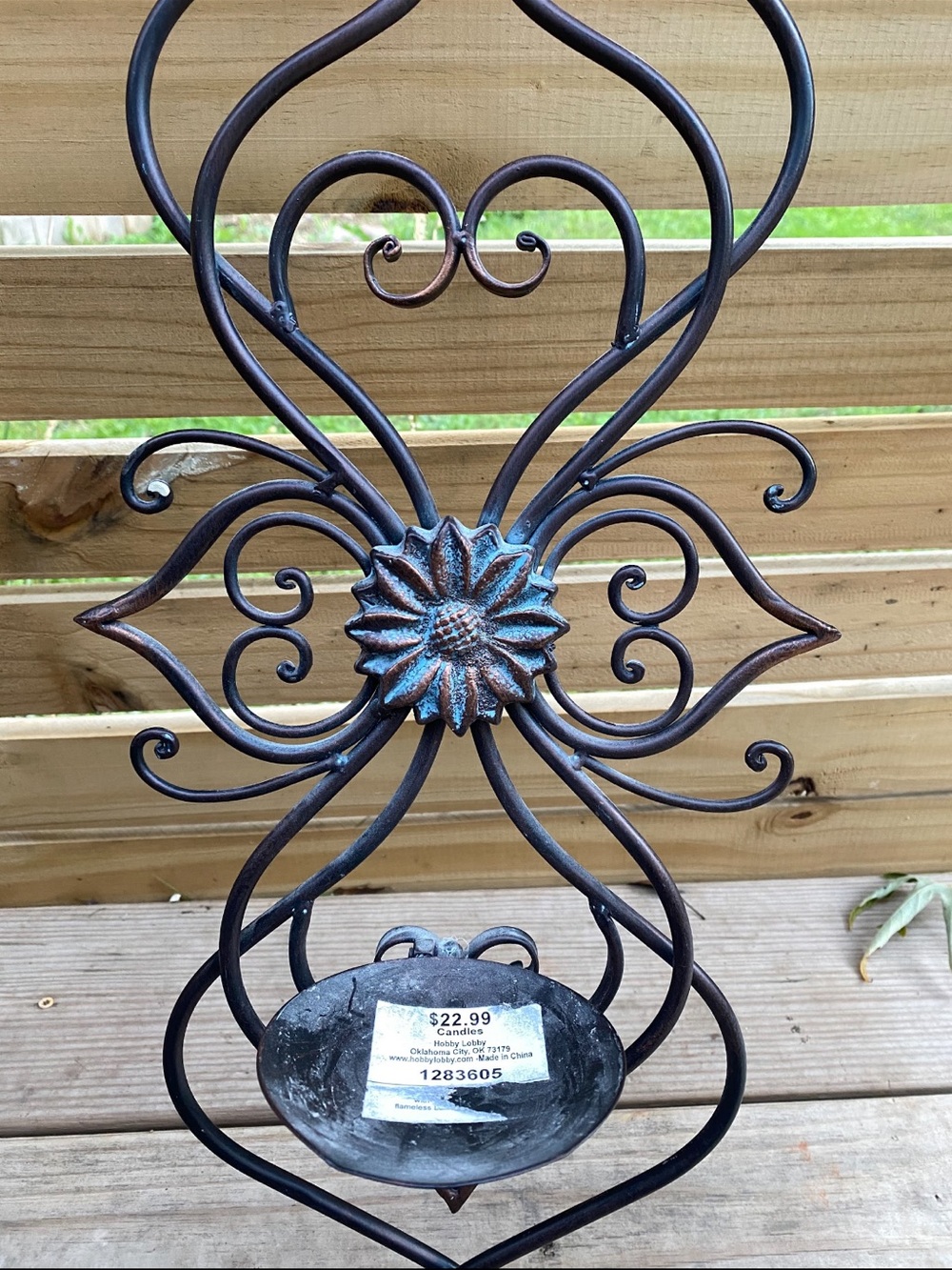 Ornate Metal Wall Sconce with Patina Flower Accent